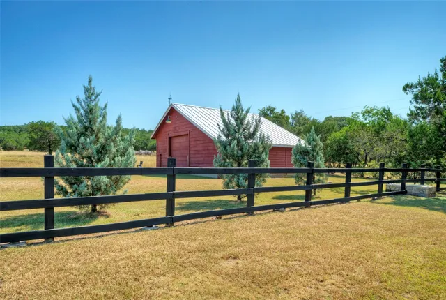 a living room with furniture a rug and a chandelier