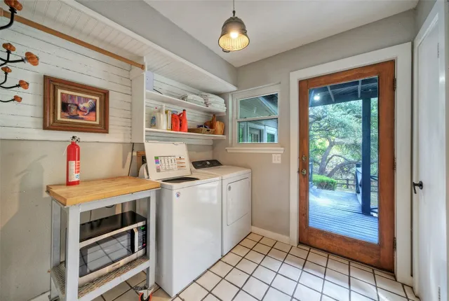 a bathroom with a sink a toilet a mirror and shower