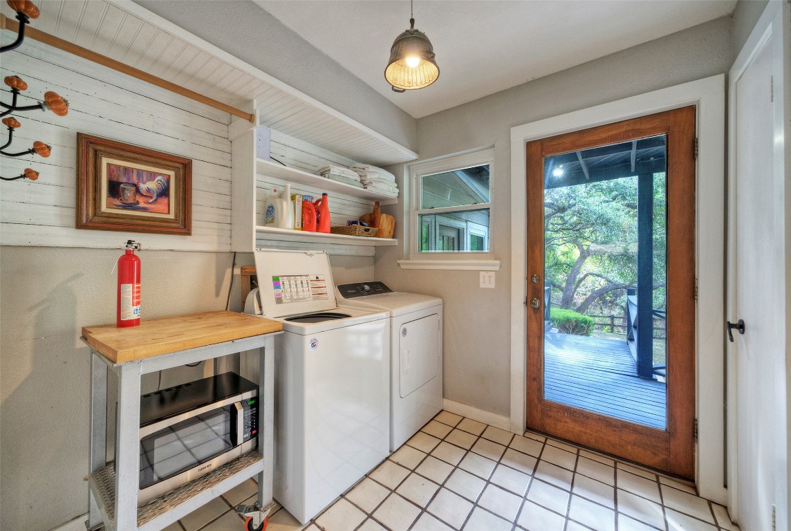 101 Arrowlake Road Wimberley, TX 78676 - Photo 33 of 40 a view of kitchen with washer and dryer