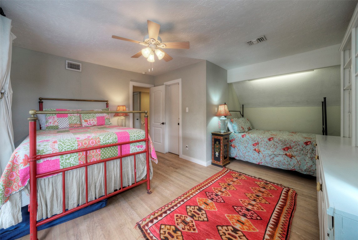 101 Arrowlake Road Wimberley, TX 78676 - Photo 35 of 40 a bedroom with bed and hallway