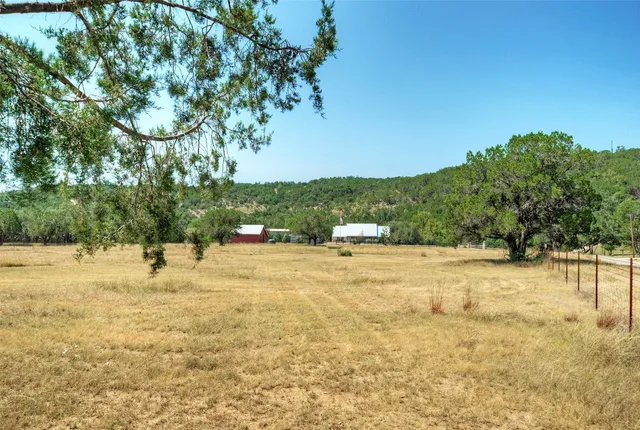 a view of a backyard with sitting area