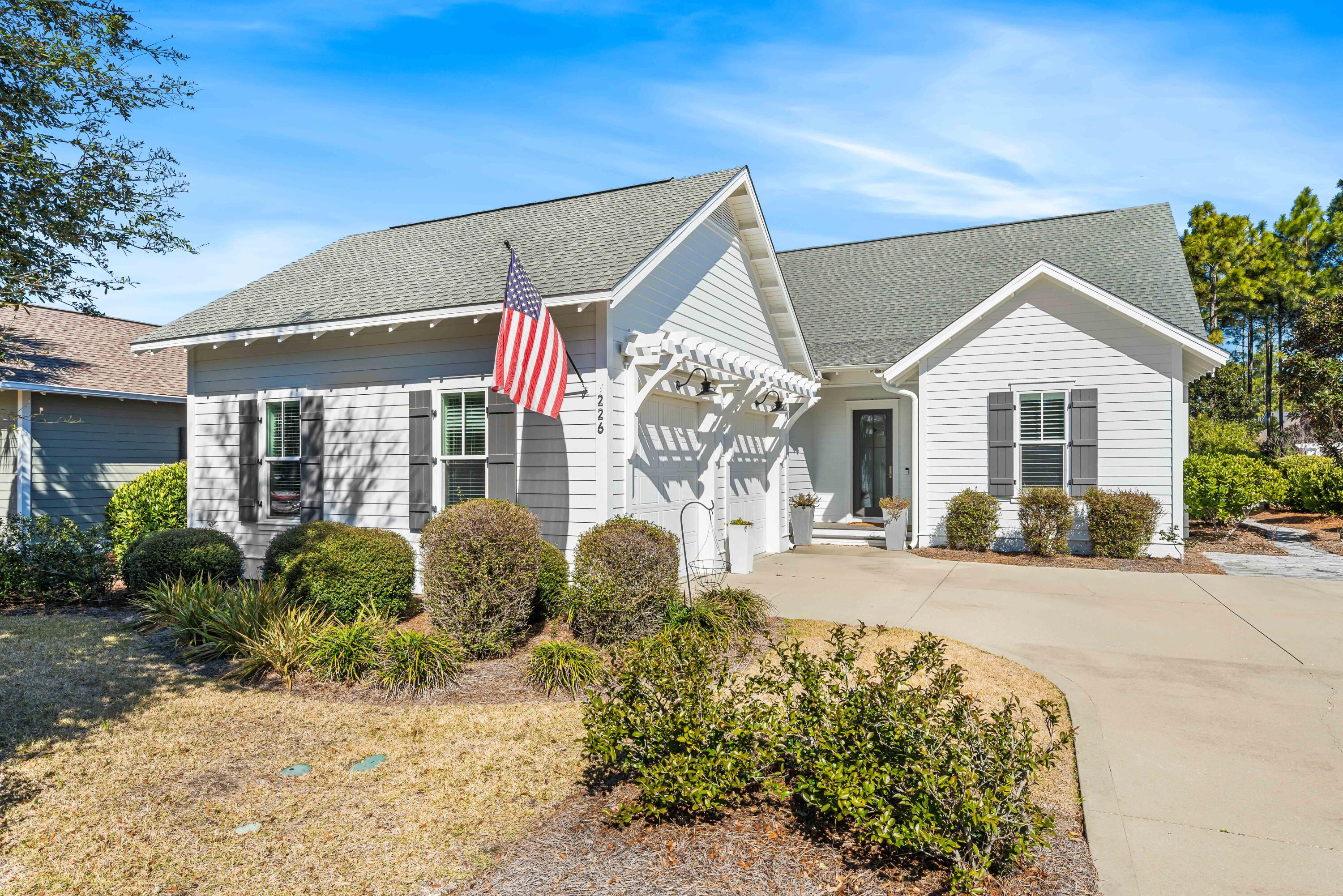 a front view of a house with garden