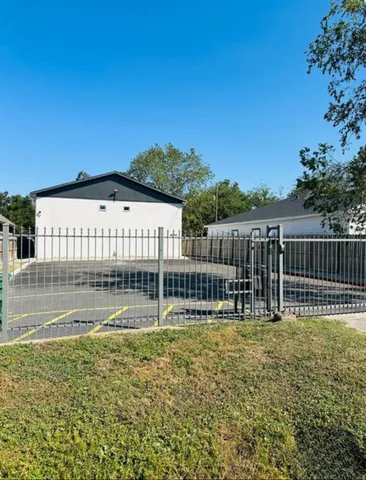 a house view with swimming pool and bench
