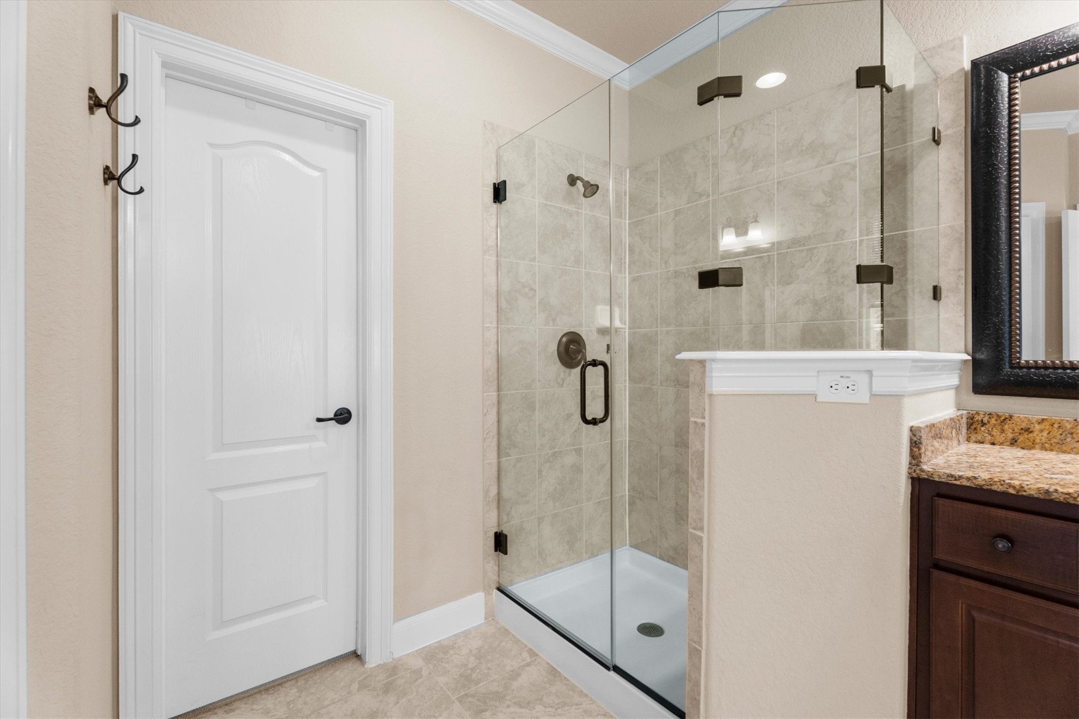 3 Indigo Bunting Place Spring, TX 77389 - Photo 23 of 41 Sleek glass-enclosed shower that has been treated for easy upkeep.