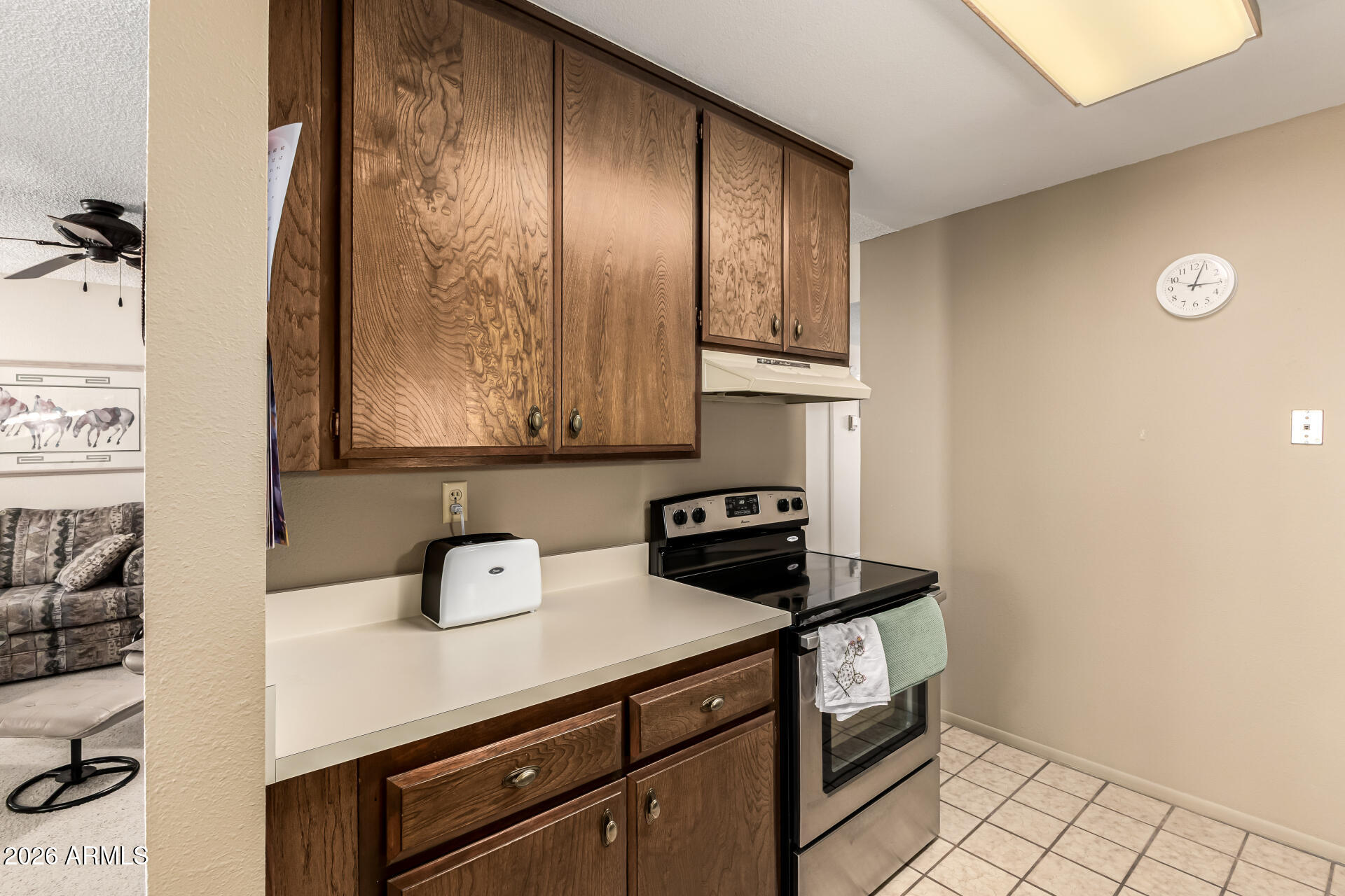 5525 East Thomas Road, Unit O8 Phoenix, AZ 85018 - Photo 13 of 32 a view of kitchen with cabinets and window