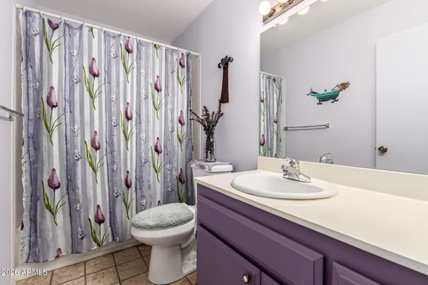 a view of a chairs and table in patio