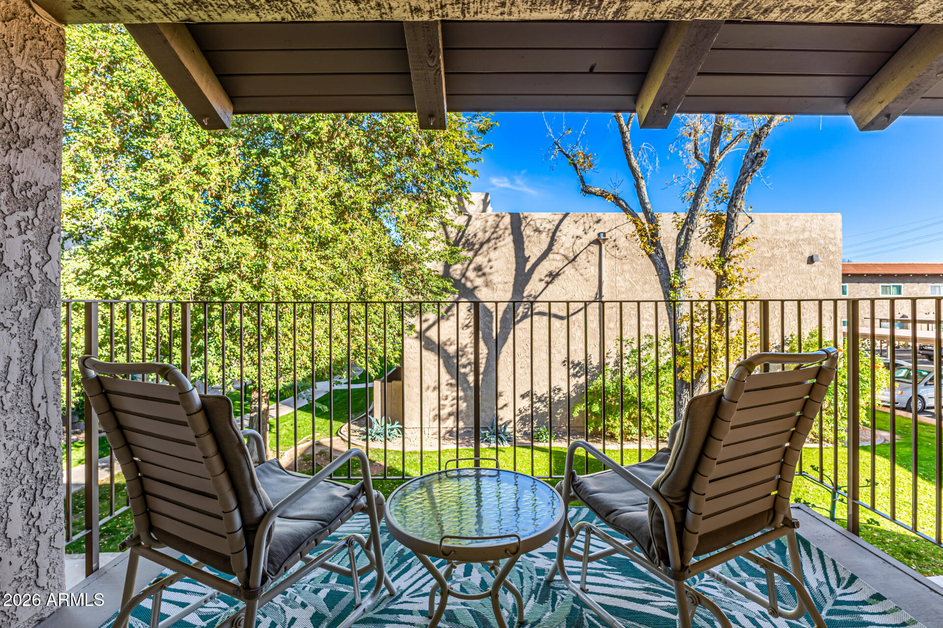 5525 East Thomas Road, Unit O8 Phoenix, AZ 85018 - Photo 21 of 32 a view of a chairs and table in patio