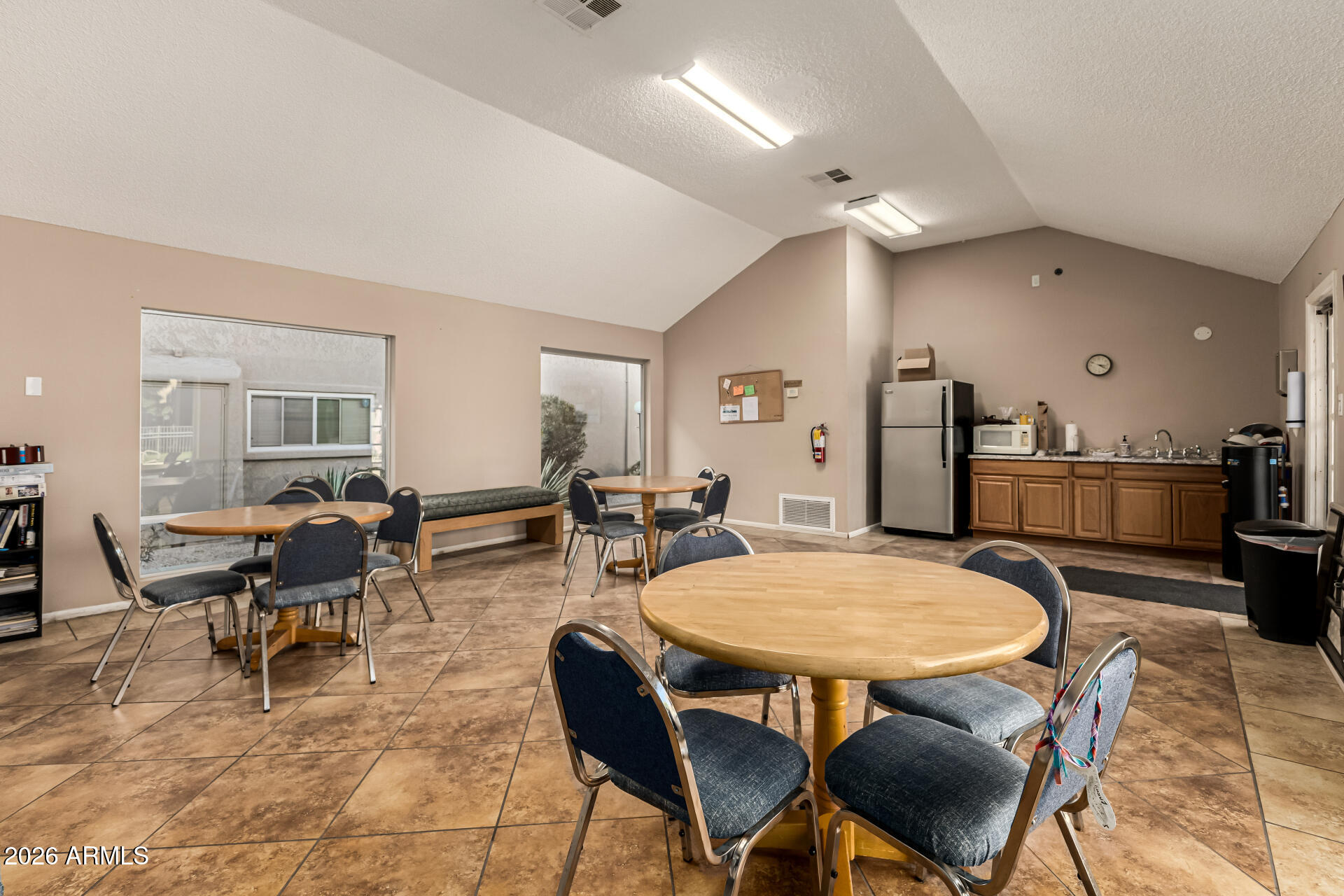 5525 East Thomas Road, Unit O8 Phoenix, AZ 85018 - Photo 26 of 32 a view of a dining room with furniture
