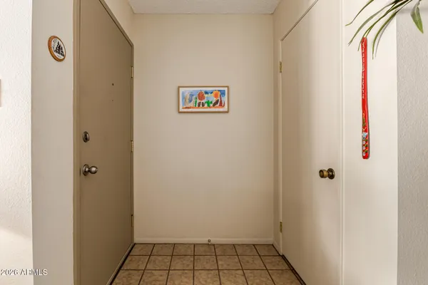 a view of a livingroom with furniture and a flat screen tv