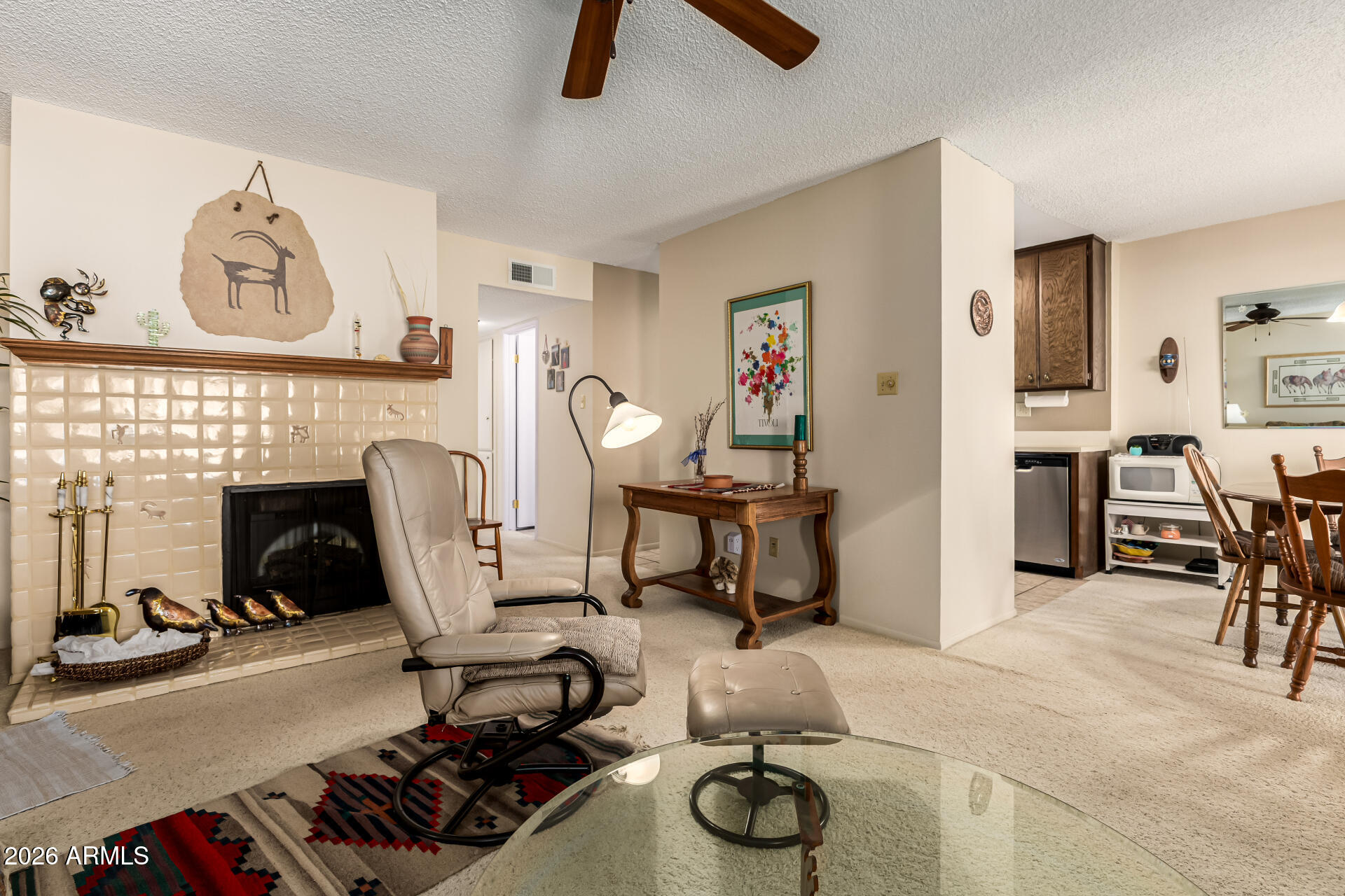 5525 East Thomas Road, Unit O8 Phoenix, AZ 85018 - Photo 7 of 32 a view of a livingroom with furniture and a fireplace