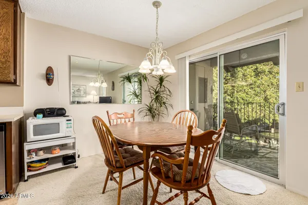 a bedroom with bed and a chandelier