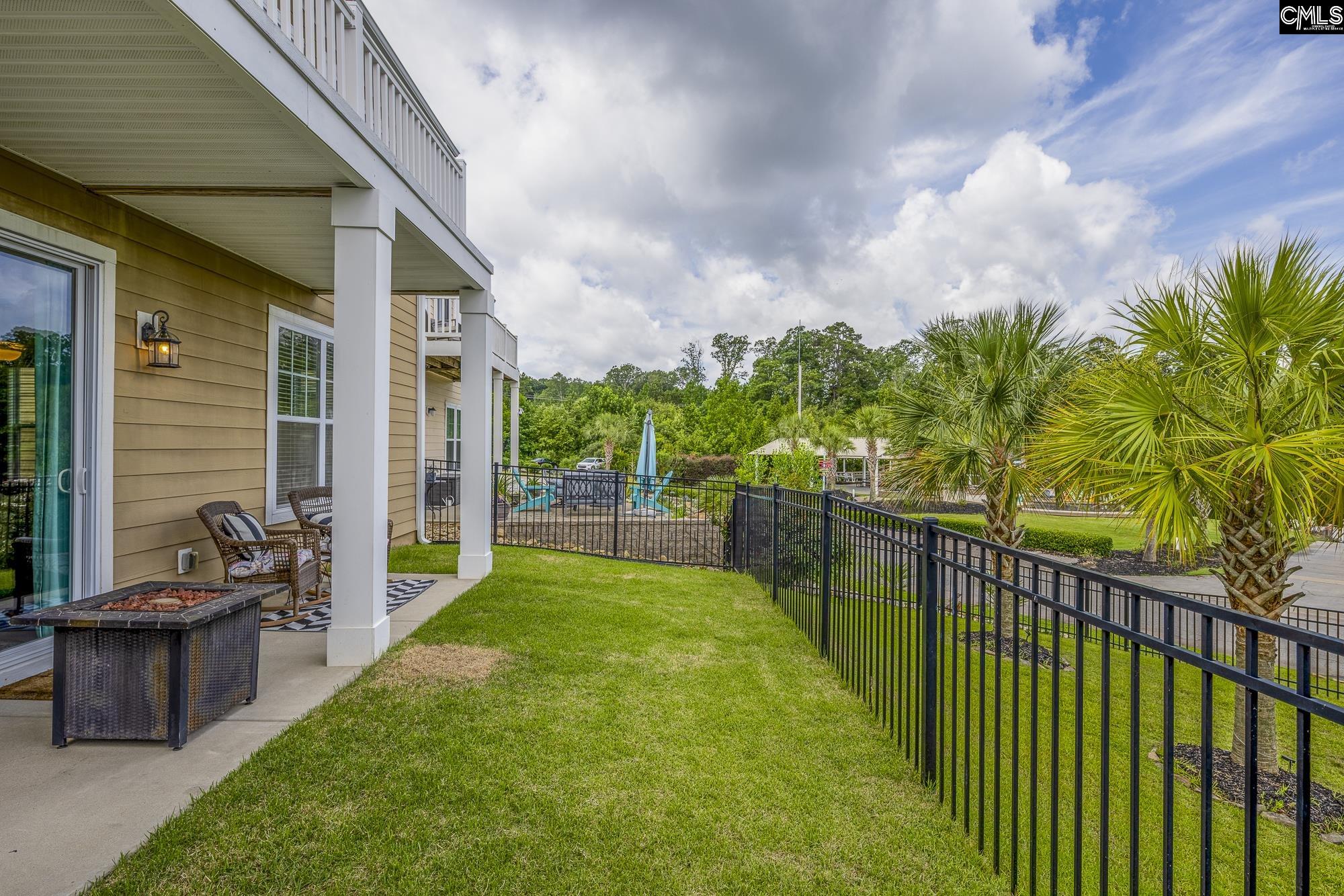 213 Sunset Point Drive Lexington, SC 29072 - Photo 32 of 35 a view of a porch with chairs and plants