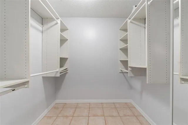 a kitchen with stainless steel appliances kitchen island hardwood floor sink and stove