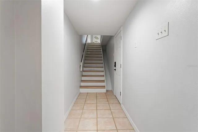 a kitchen with kitchen island granite countertop a sink and steel appliances