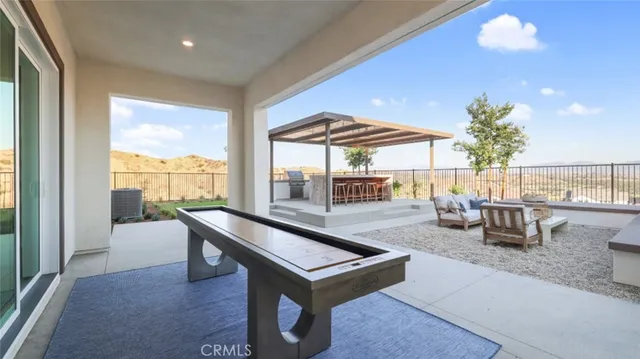 a living room with furniture a table and chairs