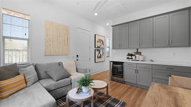 a kitchen with a refrigerator table and chairs