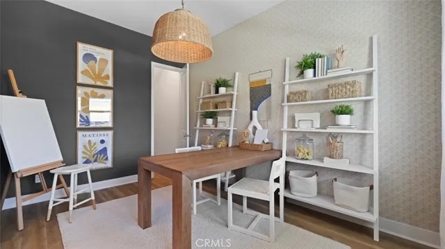 a view of a dining room with furniture and a window