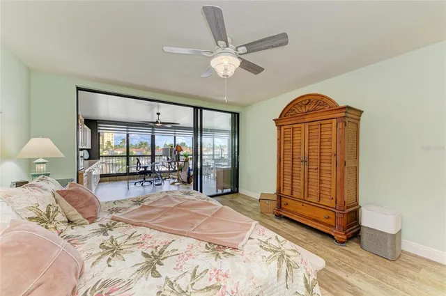 a bed room with a bed and a large window