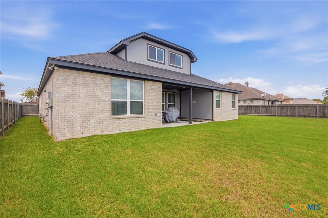 113 Terra Vista Ranch Road Victoria, TX 77904 - Photo 41 of 47 a front view of a house with a garden