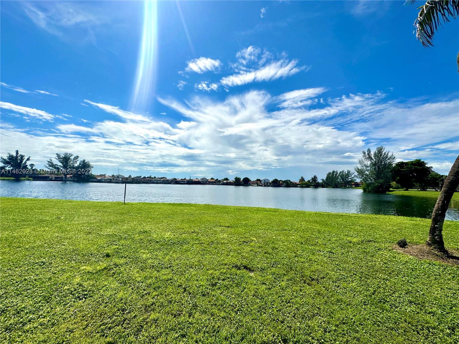 a view of a lake and a yard