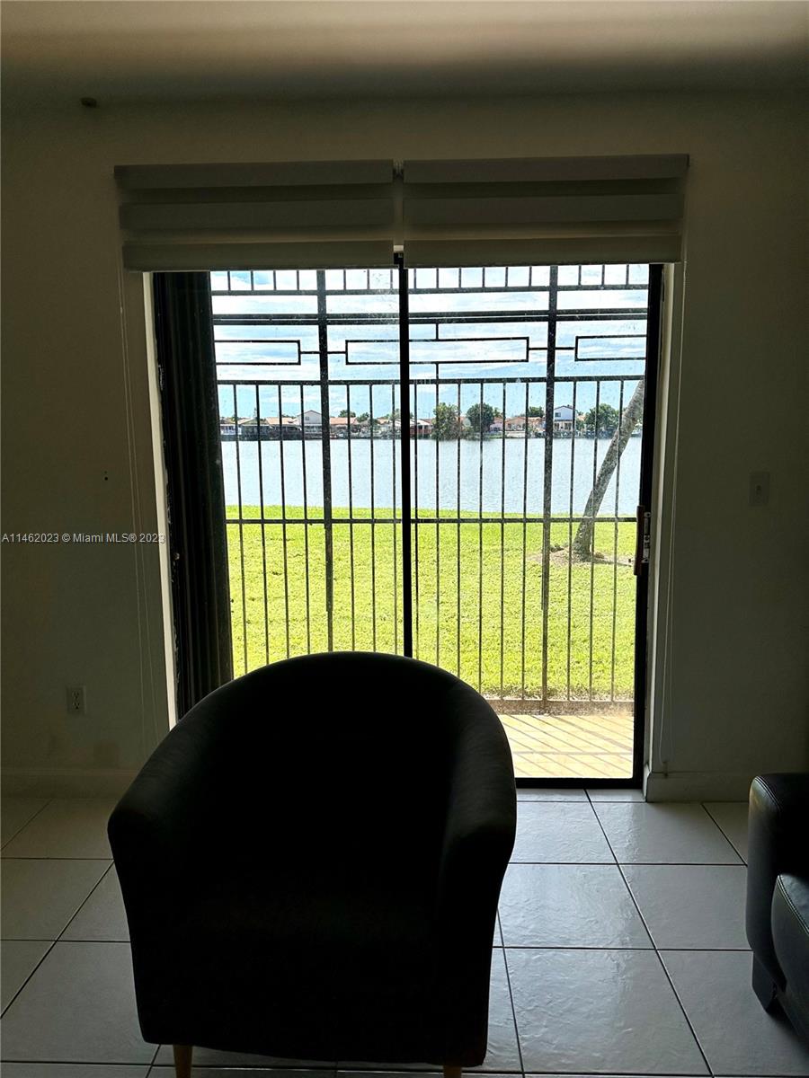 2580 West 67th Place, Unit 1011 Hialeah, FL 33016 - Photo 11 of 23 a living room with a large window