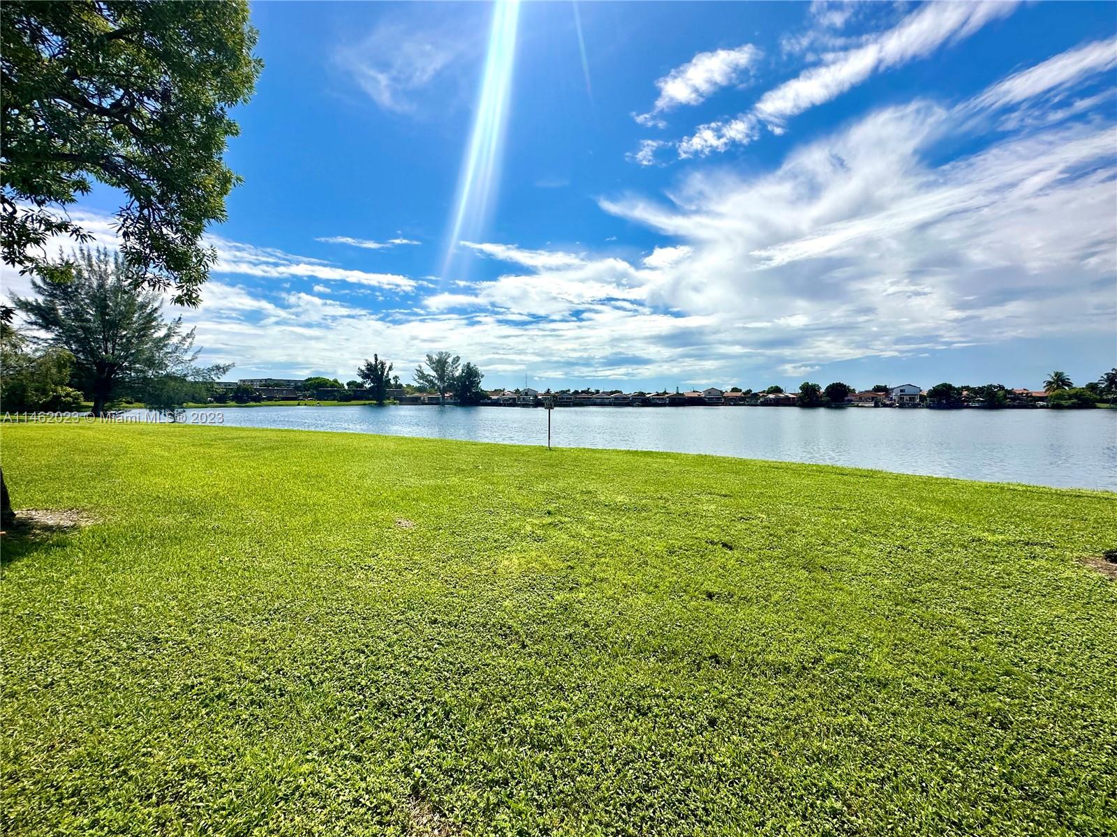 2580 West 67th Place, Unit 1011 Hialeah, FL 33016 - Photo 21 of 23 a view of an ocean from a yard