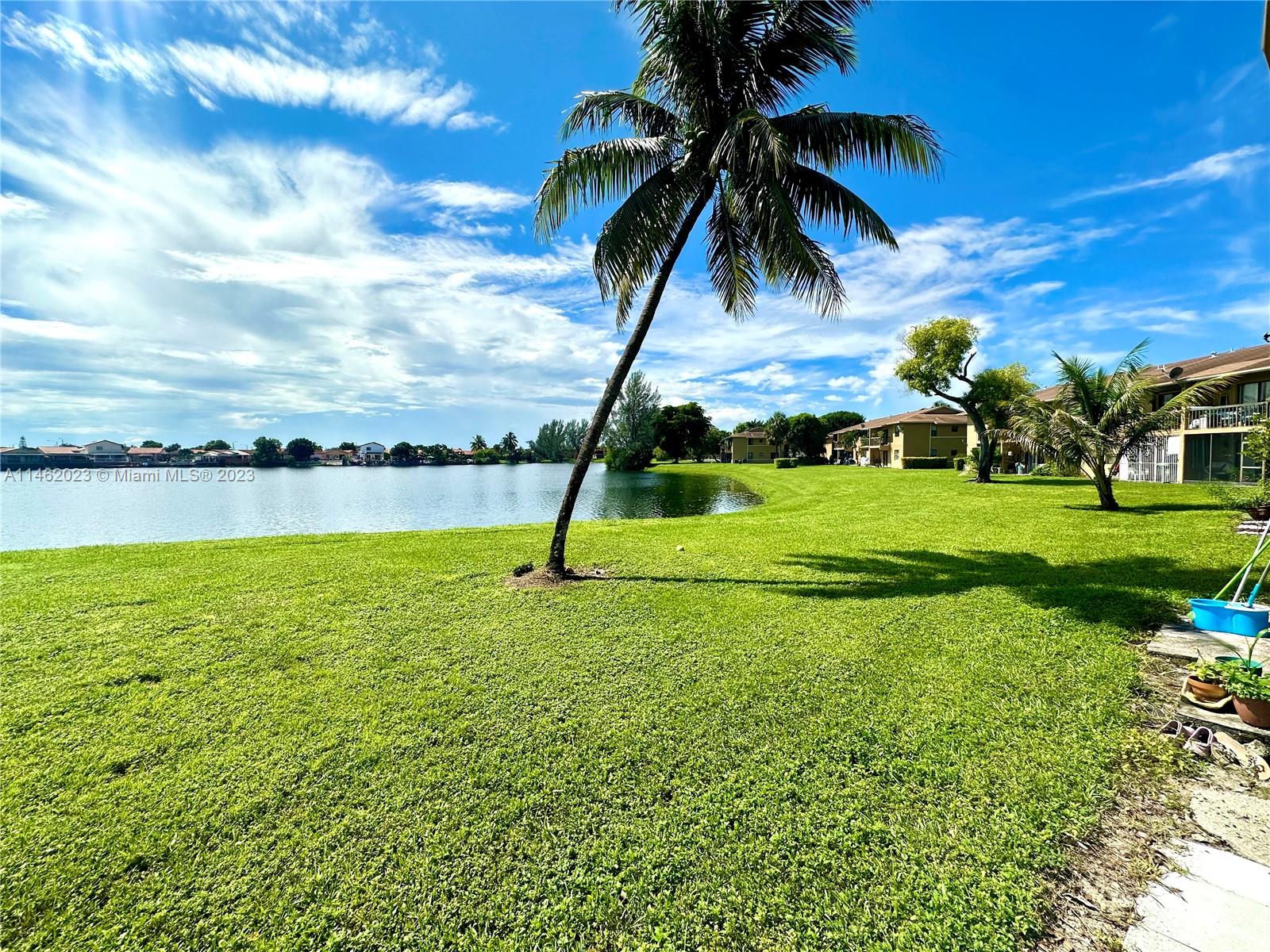 2580 West 67th Place, Unit 1011 Hialeah, FL 33016 - Photo 22 of 23 a view of a lake with a big yard