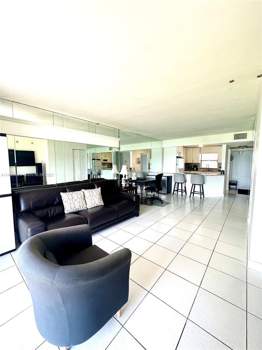 2580 West 67th Place, Unit 1011 Hialeah, FL 33016 - Photo 10 of 23 a living room with furniture and a view of living room