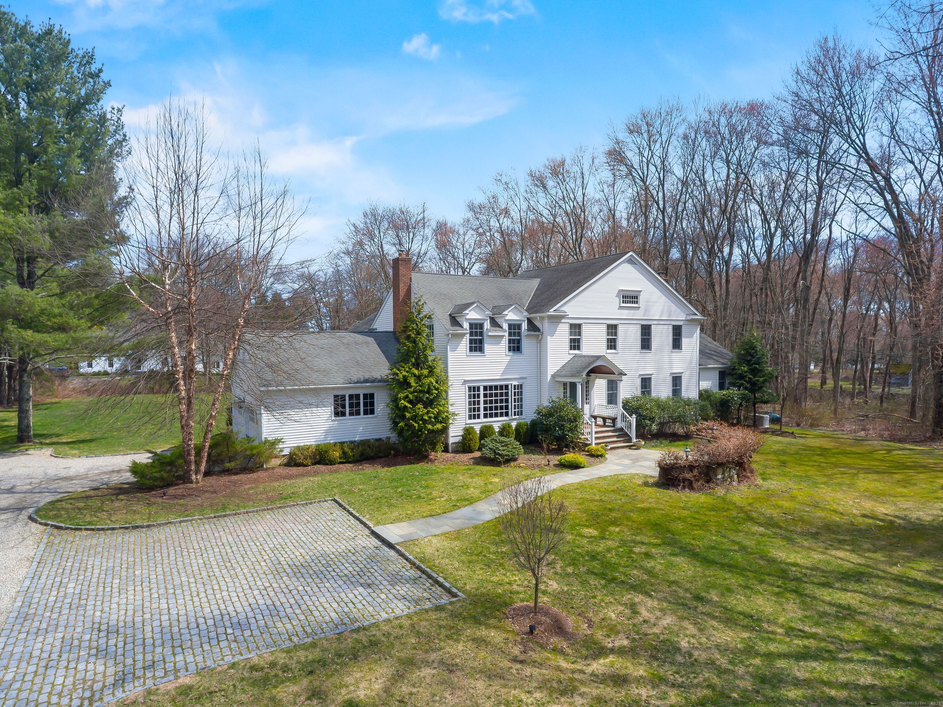 410 Redding Road Fairfield, CT 06824 - Photo 1 of 1 a front view of a house with garden