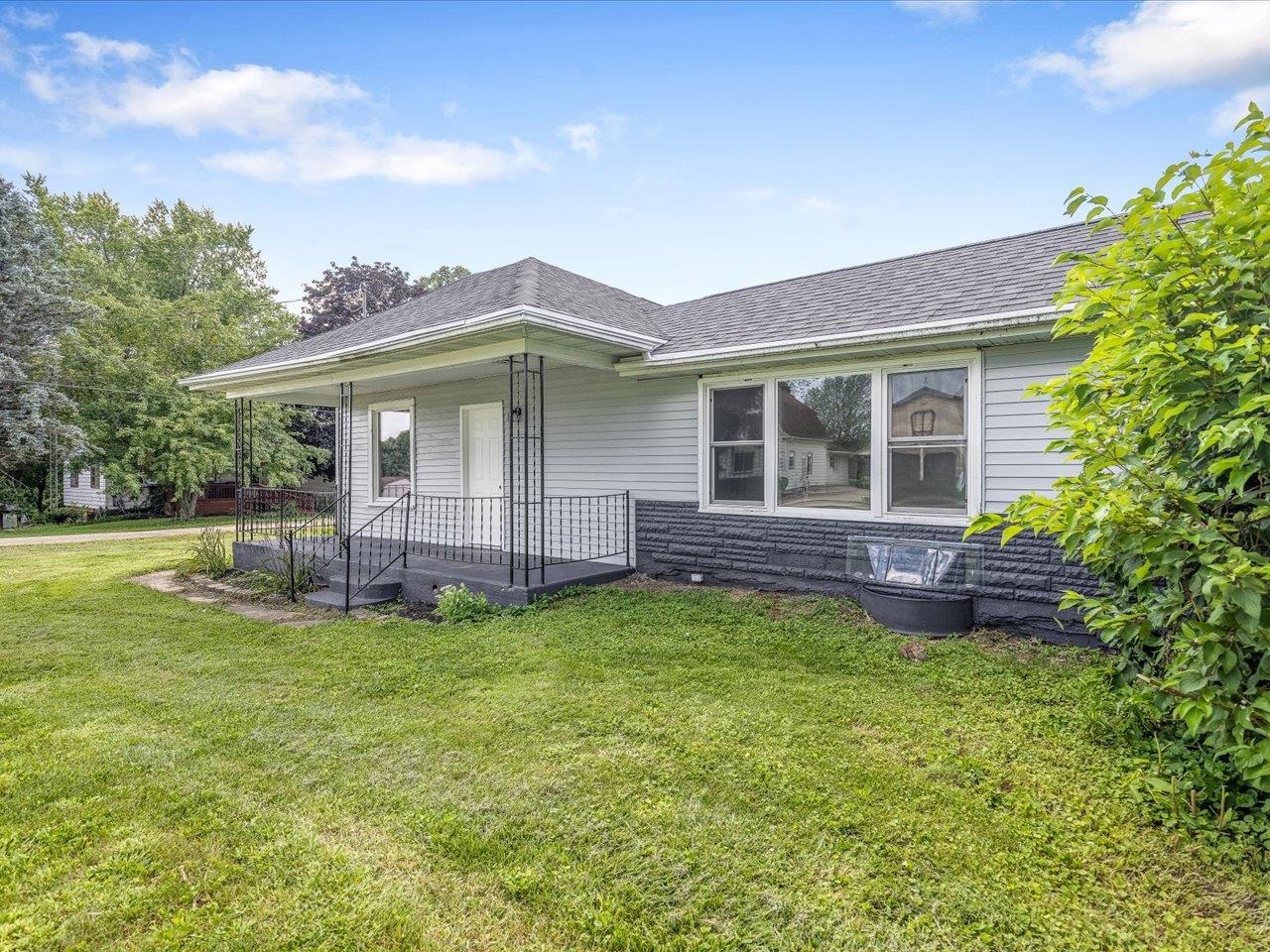 140 East Walnut Street Cedarville, IL 61032 - Photo 13 of 37 a view of a house with a yard and a porch
