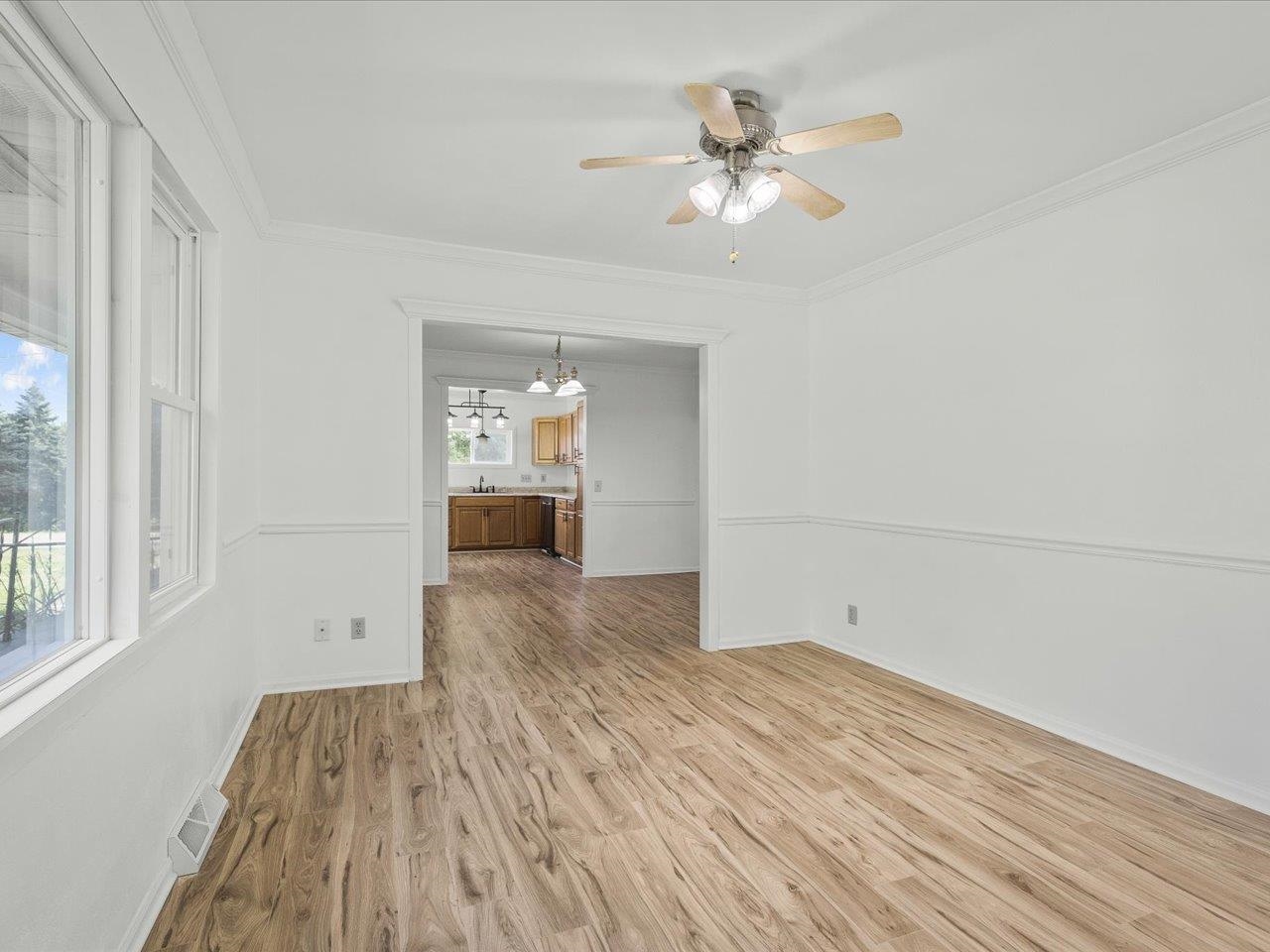 140 East Walnut Street Cedarville, IL 61032 - Photo 30 of 37 a view of empty room with wooden floor and fan