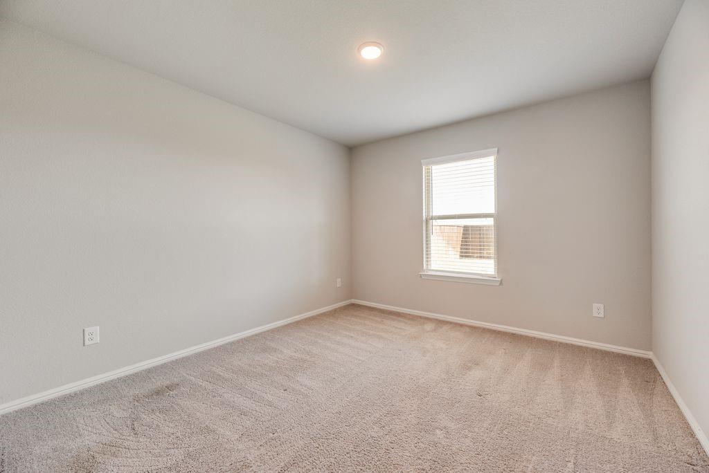 14216 Aberavon Drive Pilot Point, TX 76258 - Photo 15 of 19 Neutral-toned wall paint throughout