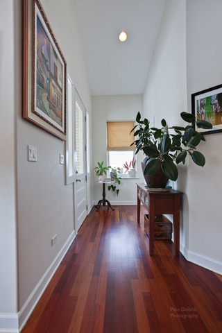 690 Lyster Road Highwood, IL 60040 - Photo 2 of 25 a room with wooden floor and a window