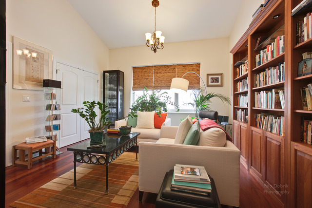 690 Lyster Road Highwood, IL 60040 - Photo 12 of 25 a living room with furniture a bookshelf and a window
