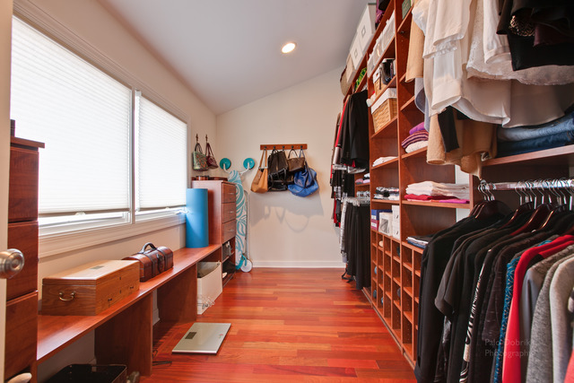 690 Lyster Road Highwood, IL 60040 - Photo 18 of 25 a view of a walk in closet with clothes and shoes