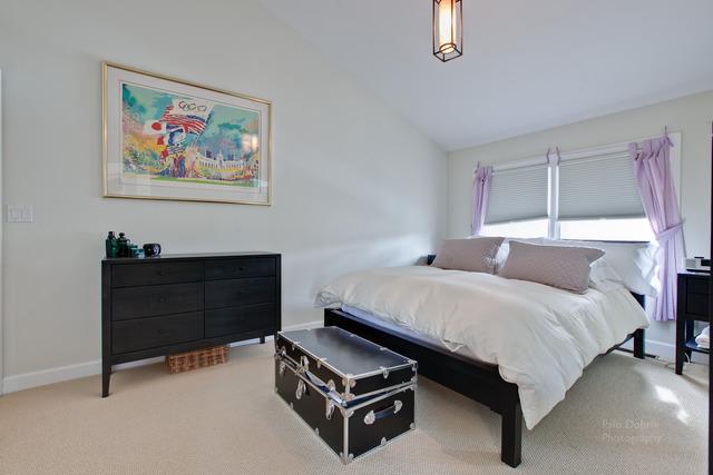 690 Lyster Road Highwood, IL 60040 - Photo 21 of 25 a bed room with a bed and a chair