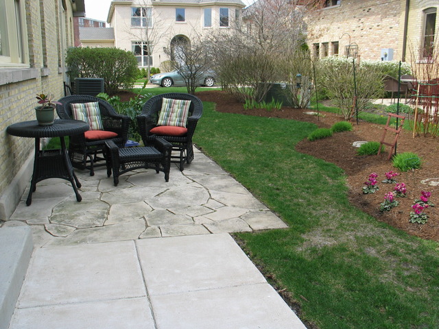 690 Lyster Road Highwood, IL 60040 - Photo 23 of 25 a view of a chairs and table in backyard of the house