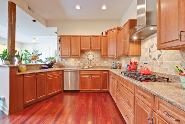 690 Lyster Road Highwood, IL 60040 - Photo 8 of 25 a kitchen with stainless steel appliances a sink dishwasher stove and cabinets