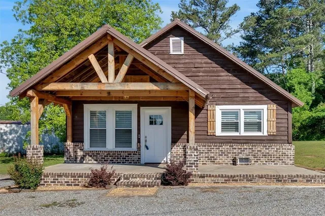 a front view of a house with garden