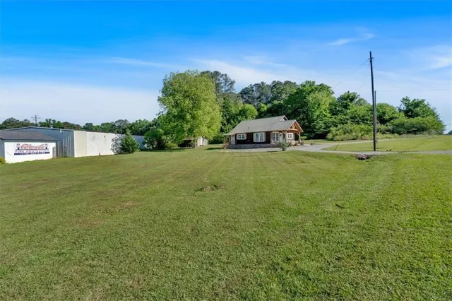 a view of a lake with a house in the background