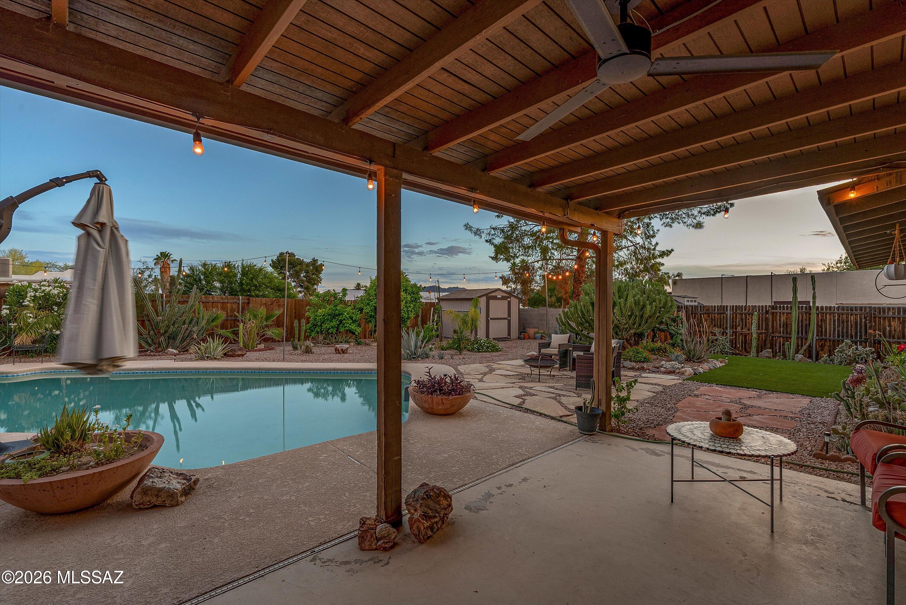 3949 West Mars Street Tucson, AZ 85741 - Photo 8 of 27 a backyard of a house with barbeque oven table and chairs