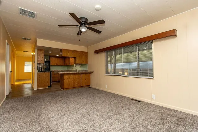 a view of a kitchen with a sink and cabinet area