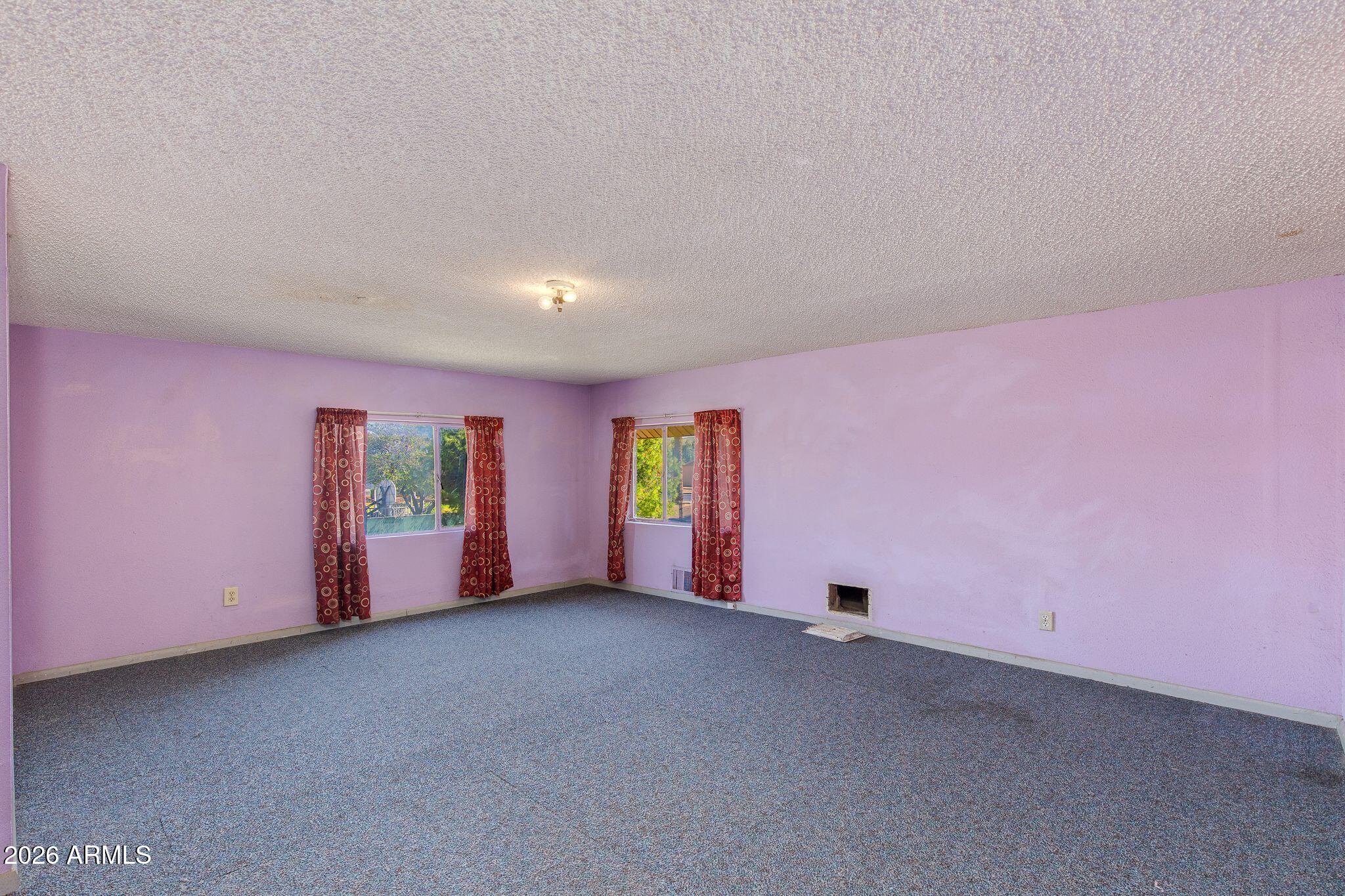 316 West Roeser Road Phoenix, AZ 85041 - Photo 10 of 35 a view of an empty room with a window