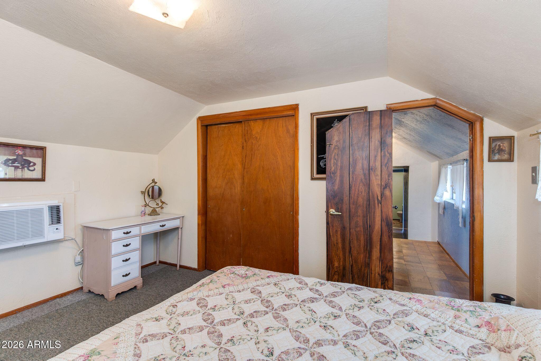 316 West Roeser Road Phoenix, AZ 85041 - Photo 25 of 35 a bedroom with a bed and a dresser in it