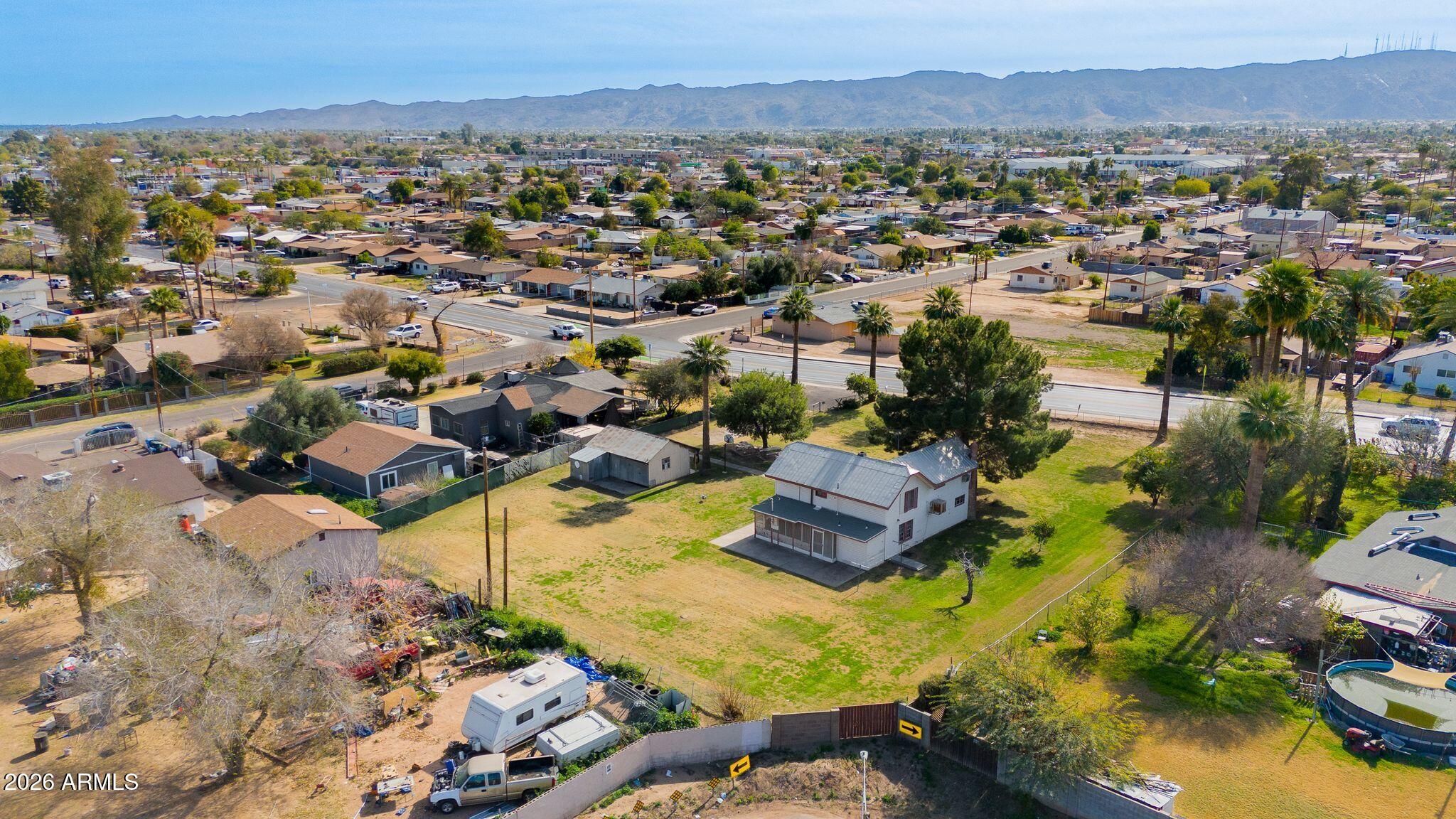 316 West Roeser Road Phoenix, AZ 85041 - Photo 28 of 35 an aerial view of residential houses with outdoor space