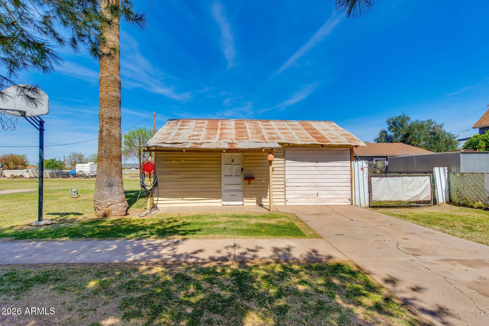 316 West Roeser Road Phoenix, AZ 85041 - Photo 3 of 35 a front view of a house with a yard