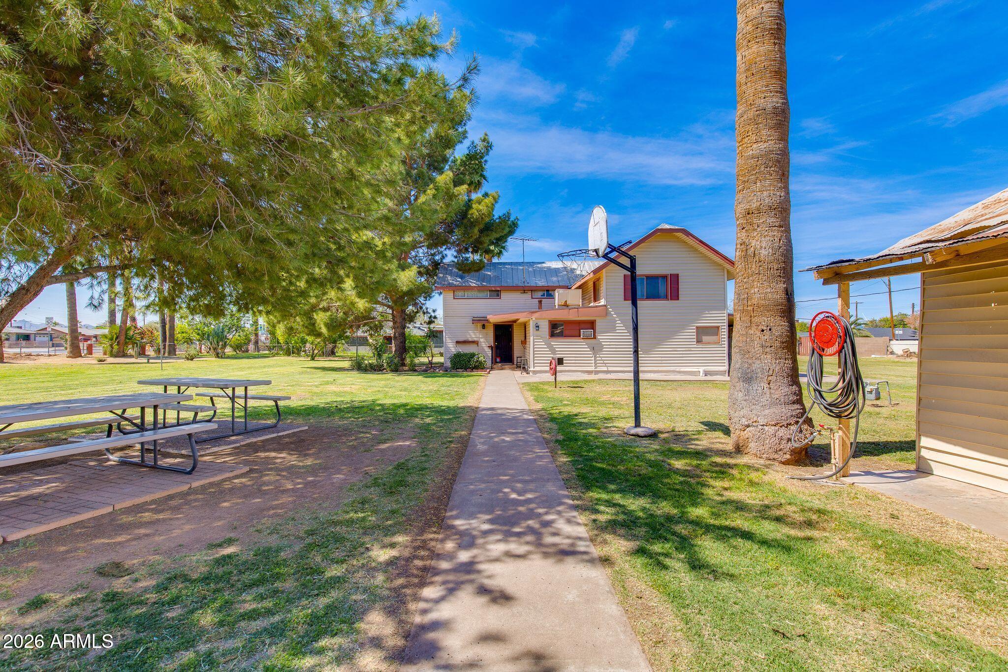 316 West Roeser Road Phoenix, AZ 85041 - Photo 4 of 35 a view of a house with a yard