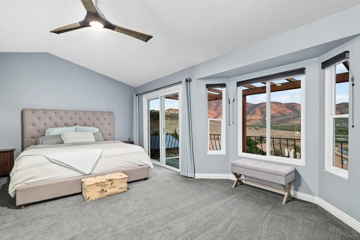 10145 Greenleaf Road Spring Valley, CA 91977 - Photo 14 of 37 a spacious bedroom with a bed and a large window