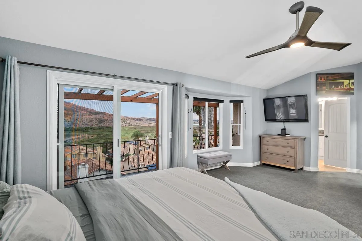 10145 Greenleaf Road Spring Valley, CA 91977 - Photo 15 of 37 a bedroom with furniture and large windows