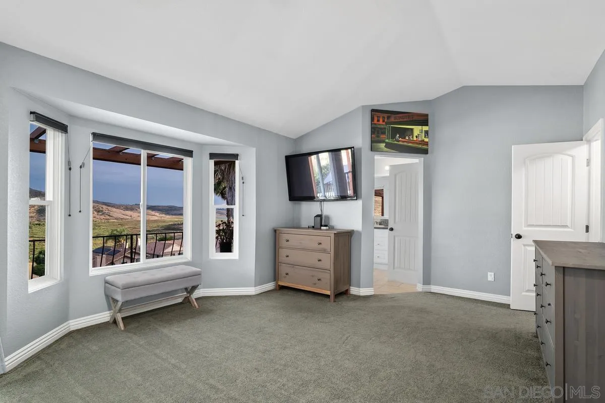 10145 Greenleaf Road Spring Valley, CA 91977 - Photo 16 of 37 a living room with furniture and a flat screen tv